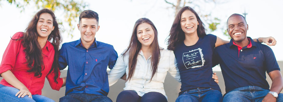 students-cropped group of people sitting on bench near trees duting daytime