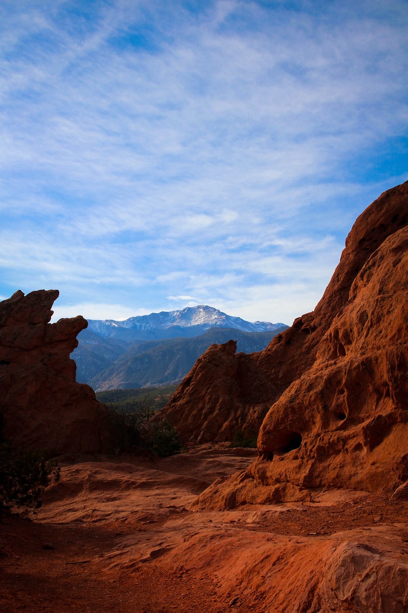 Photo by Alexis Gethin brown rocky mountain under blue sky during daytime